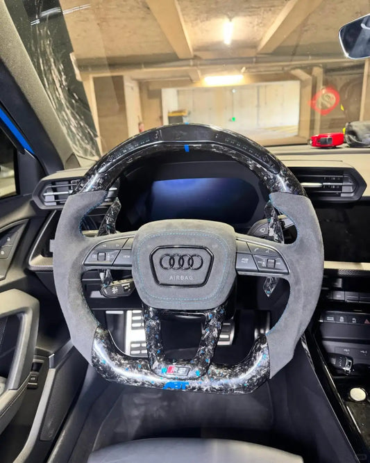 Customized Audi steering wheel forged with carbon, LED, and carbon paddles
