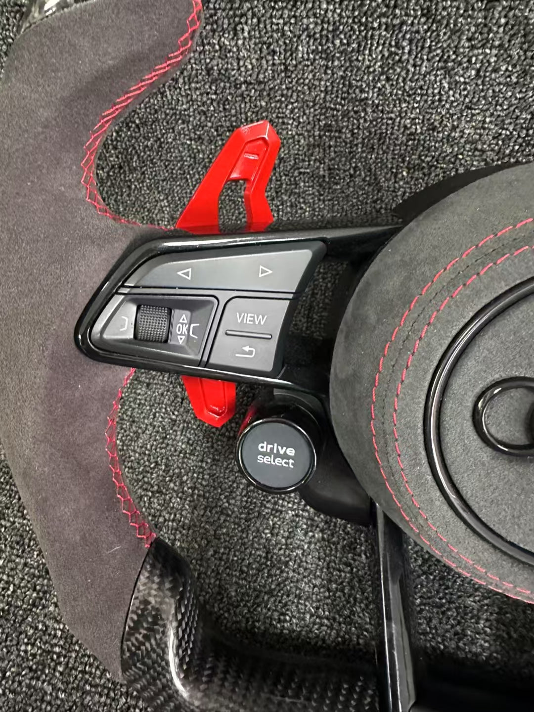 Carbon fiber sports steering wheel - red paddle shifters + Alcantara grips + Alcantara airbag cover + dual-function knob