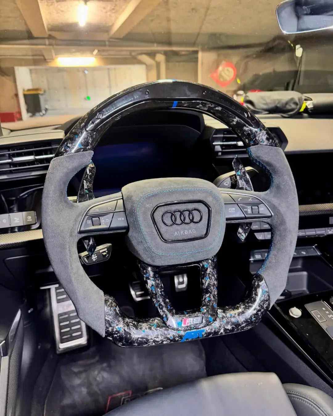 Customized Audi steering wheel forged with carbon, LED, and carbon paddles