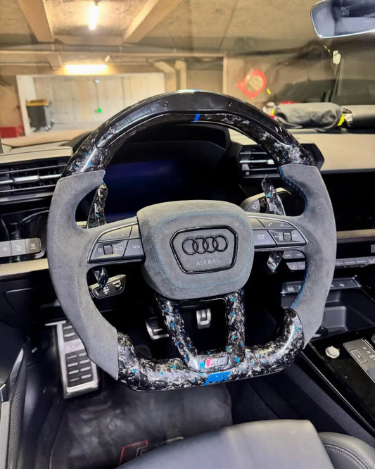 Customized Audi steering wheel forged with carbon, LED, and carbon paddles