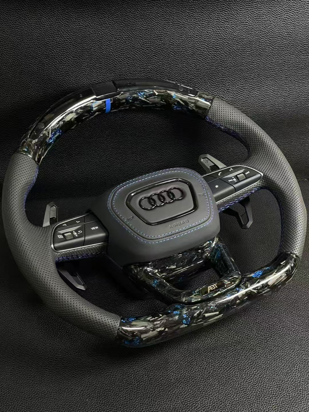 Customized Audi steering wheel forged with carbon, LED, and carbon paddles