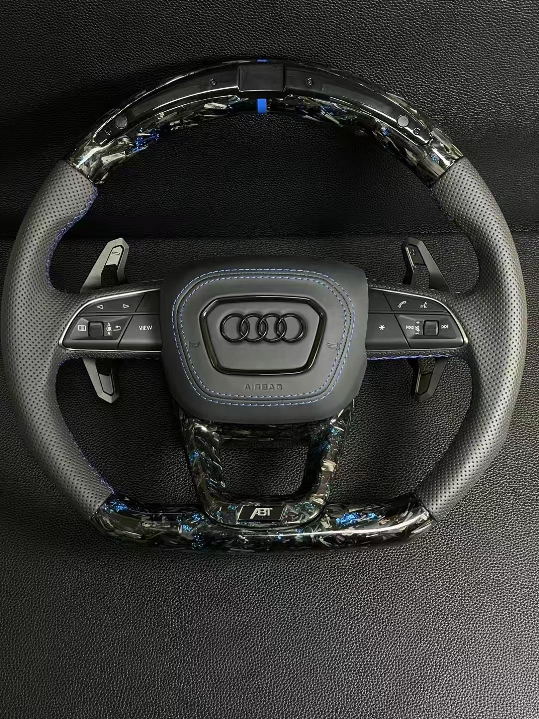 Customized Audi steering wheel forged with carbon, LED, and carbon paddles