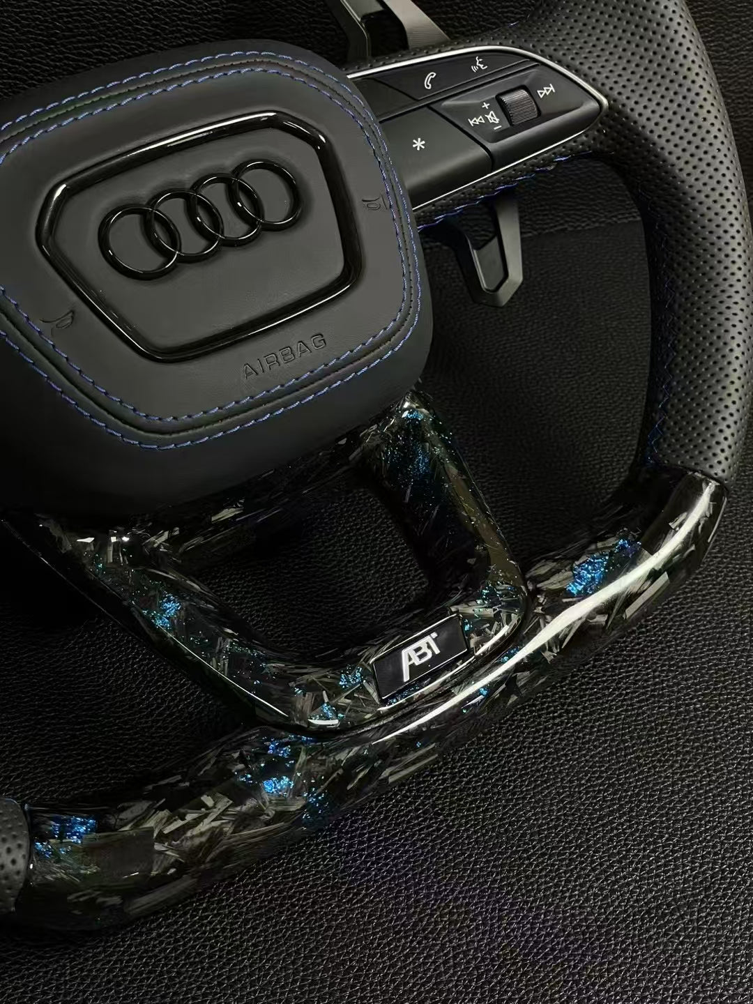 Customized Audi steering wheel forged with carbon, LED, and carbon paddles