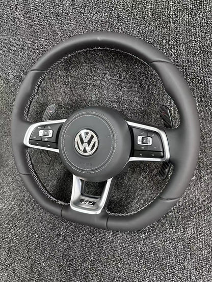 The all-new Volkswagen R line features a flat bottomed sport multifunction steering wheel with multifunctional buttons and carbon fiber paddles