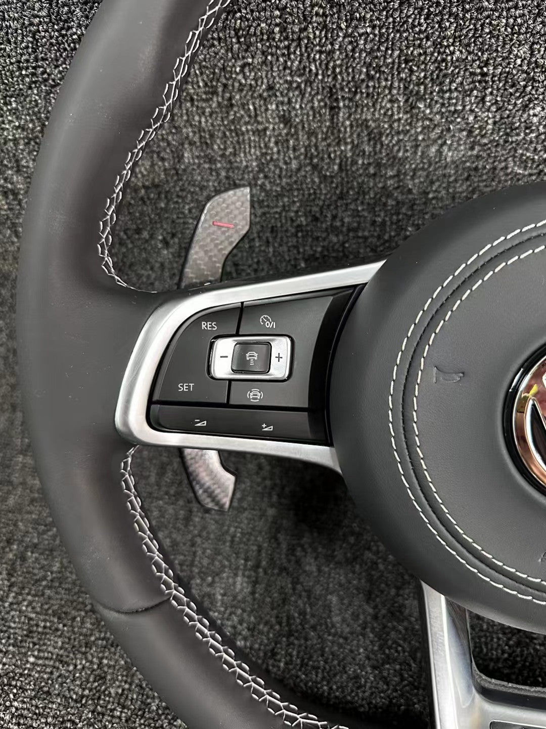 The all-new Volkswagen R line features a flat bottomed sport multifunction steering wheel with multifunctional buttons and carbon fiber paddles