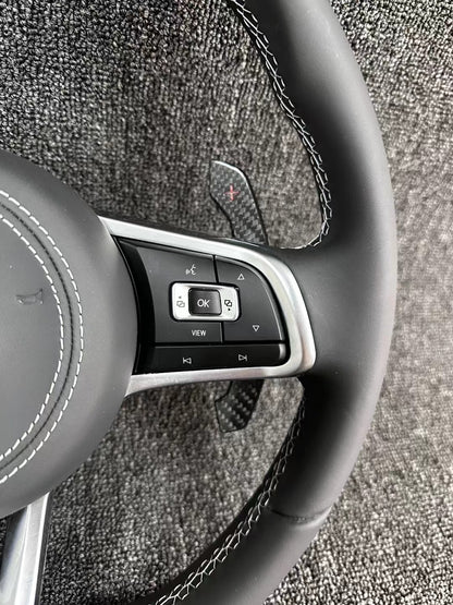 The all-new Volkswagen R line features a flat bottomed sport multifunction steering wheel with multifunctional buttons and carbon fiber paddles