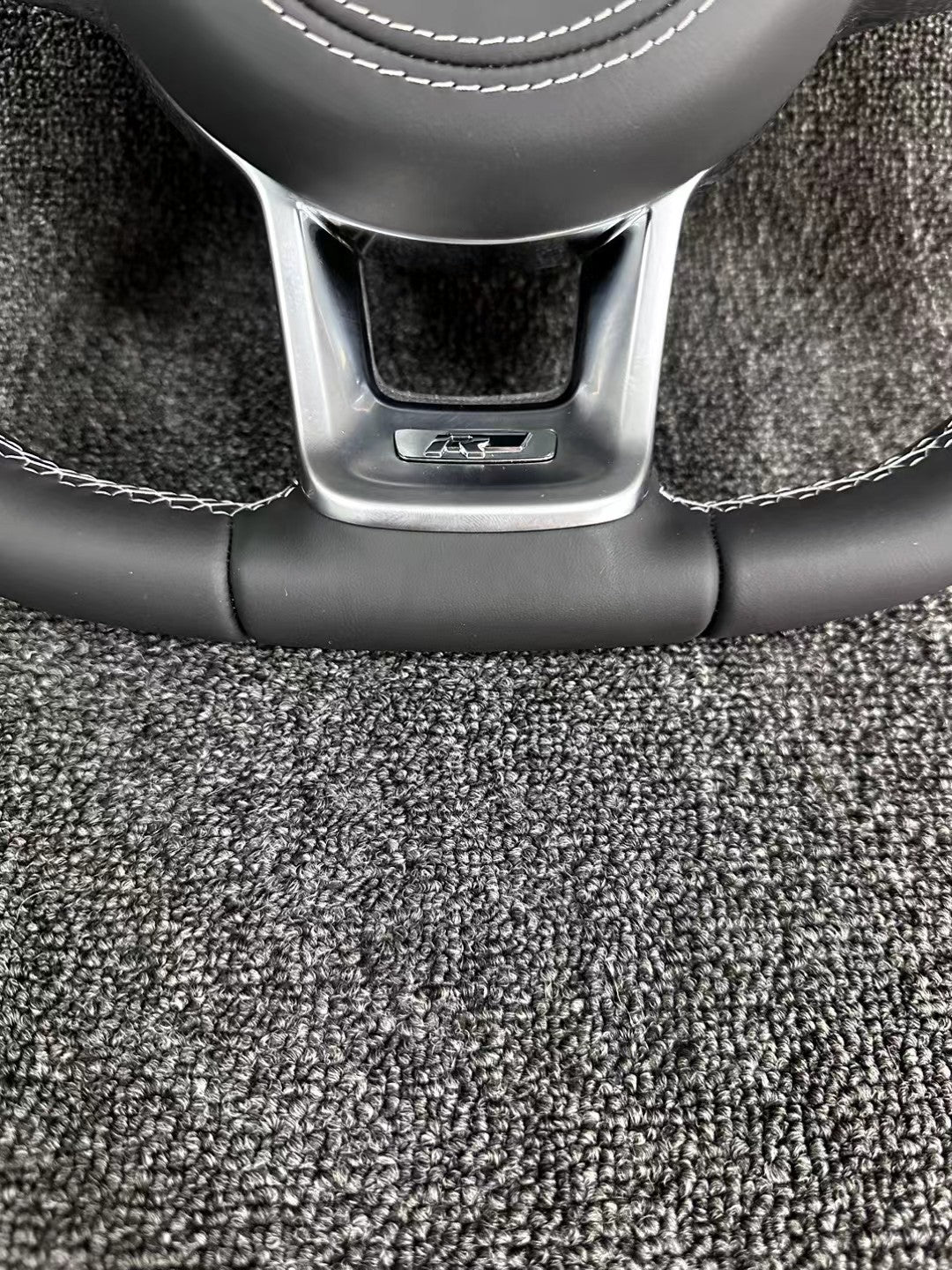 The all-new Volkswagen R line features a flat bottomed sport multifunction steering wheel with multifunctional buttons and carbon fiber paddles