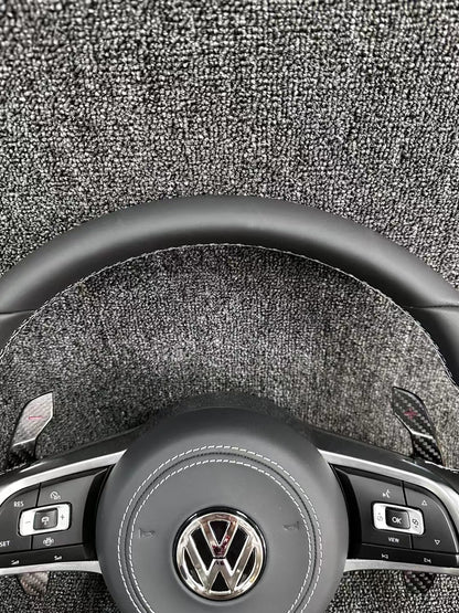 The all-new Volkswagen R line features a flat bottomed sport multifunction steering wheel with multifunctional buttons and carbon fiber paddles