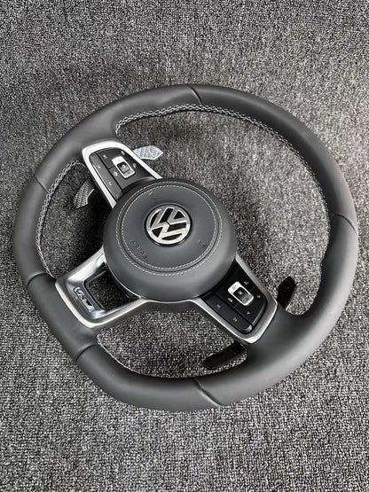 The all-new Volkswagen R line features a flat bottomed sport multifunction steering wheel with multifunctional buttons and carbon fiber paddles