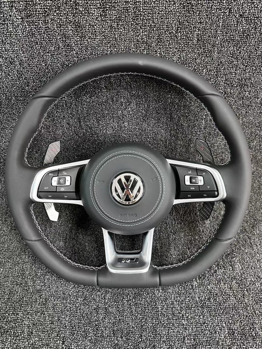 The all-new Volkswagen R line features a flat bottomed sport multifunction steering wheel with multifunctional buttons and carbon fiber paddles