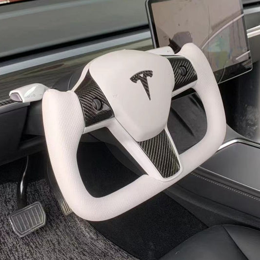 Yoke steering wheel with bright carbon or matte carbon trim with carbon side panels and heated custom speaker covers for Tesla Model 3/Y